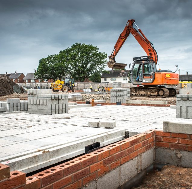 Tractor, building materials on construction site